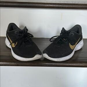 Nike women’s Black and Gold Sneakers